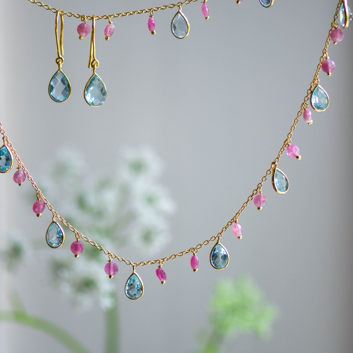 Tear Drop Earrings in Gold with Sky Blue Topaz