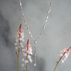 The Y Drop Necklace in Silver and Zirconia