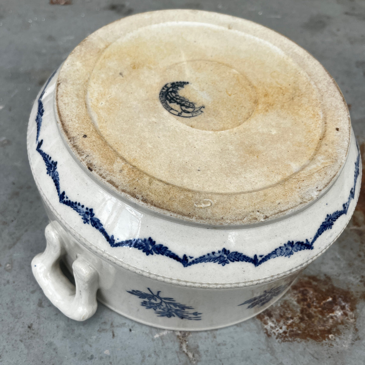 A vintage French provincial White Eartenware Bowl with Cobalt Blue Floral Decorations