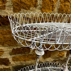 A Vintage Two-Tiered French Wirework Plant Stand with Ornate Detailing