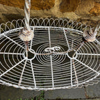 A Vintage Two-Tiered French Wirework Plant Stand with Ornate Detailing