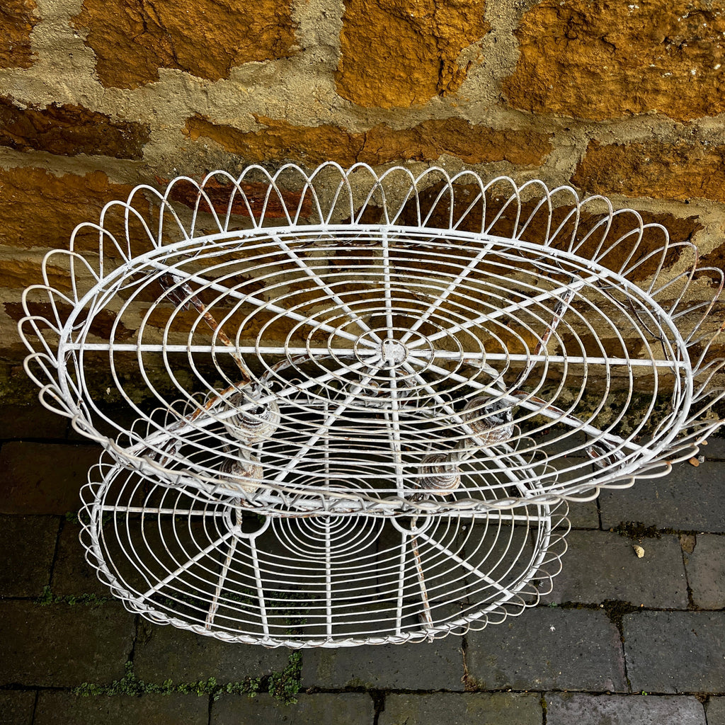 A Vintage Two-Tiered French Wirework Plant Stand with Ornate Detailing