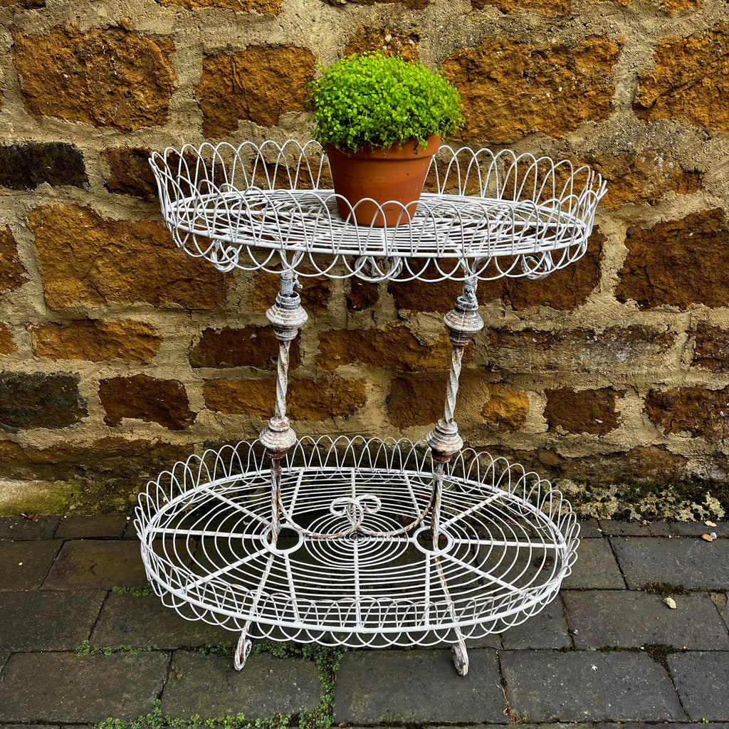 A Vintage Two-Tiered French Wirework Plant Stand with Ornate Detailing