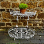 A Vintage Two-Tiered French Wirework Plant Stand with Ornate Detailing