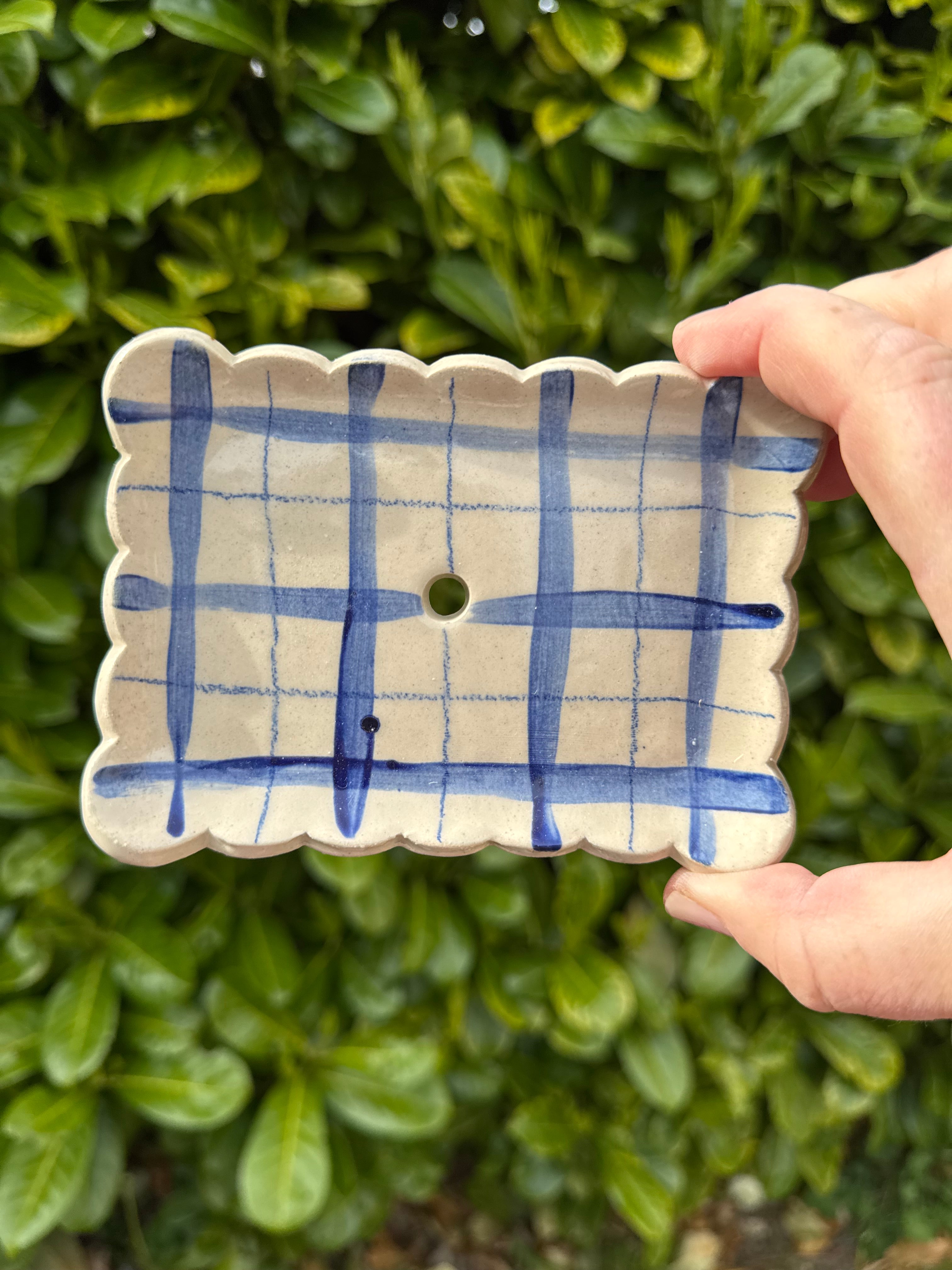 Rectangular scalloped edged soap dish with drainage hole