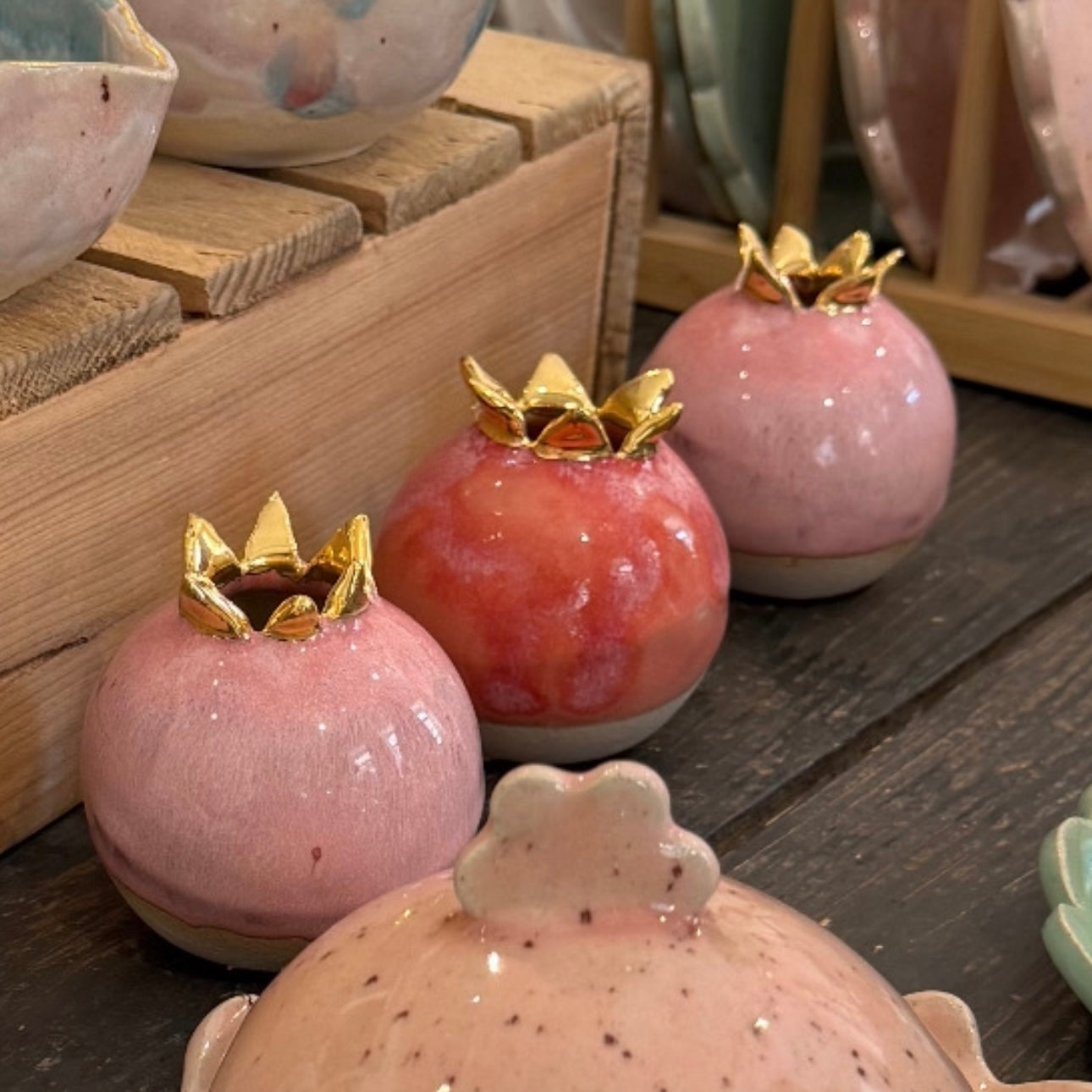 Small pomegranate vase with hot pink glaze and 24 carat gold crown detail