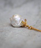 Baroque pearl and uncut diamond pendant