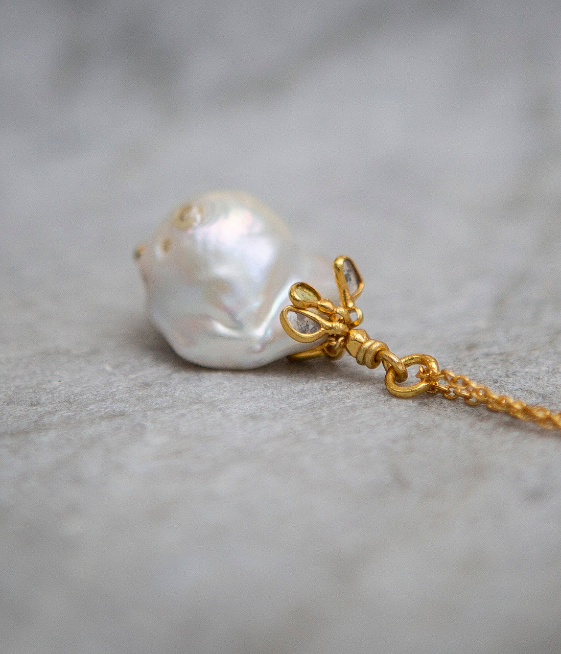 Baroque pearl and uncut diamond pendant