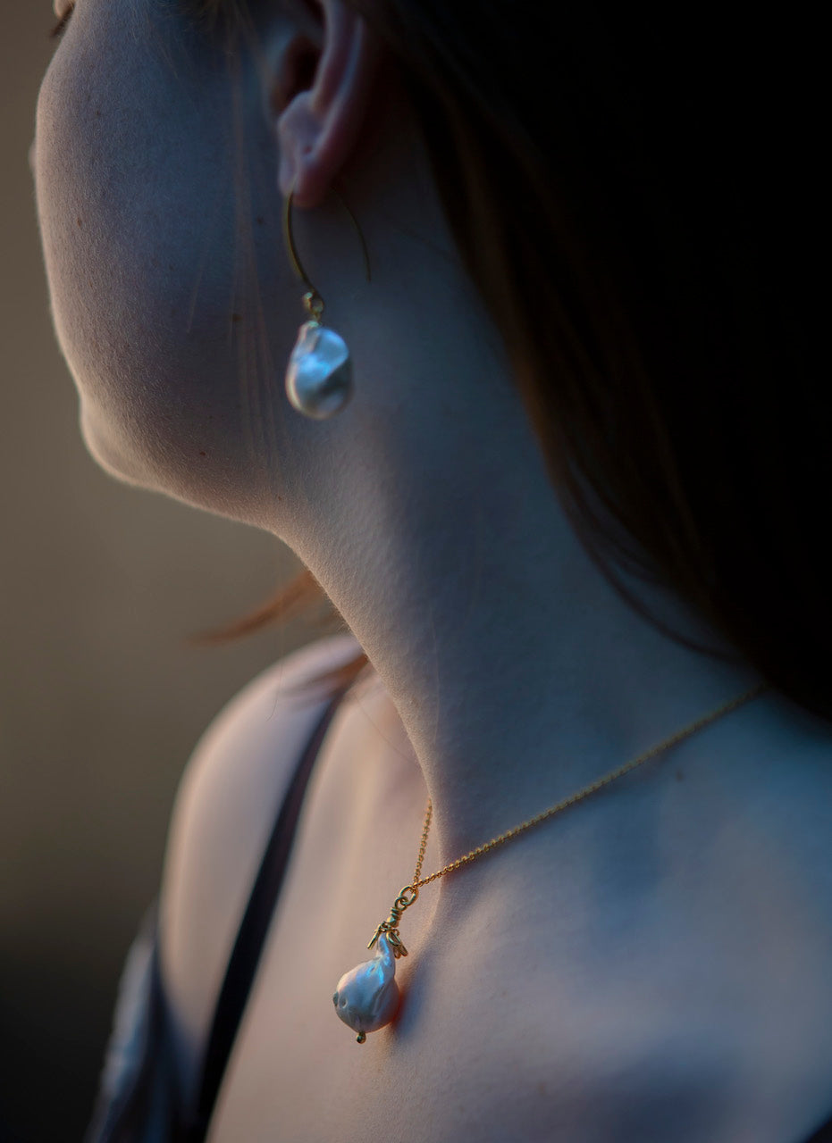 Baroque pearl and uncut diamond pendant