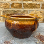 A Rustic, Glazed Redware Pot With Mottled Brown and Amber Colouration