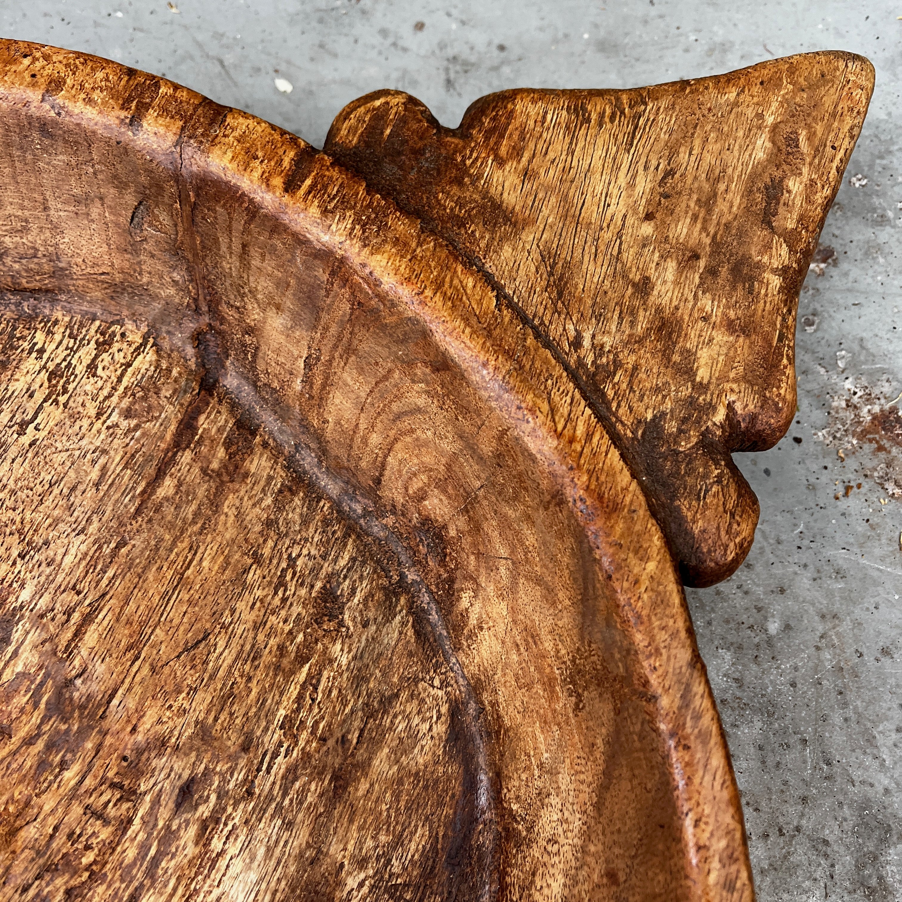 Rustic Hand-carved Wooden Bowl with a Decorative Handle