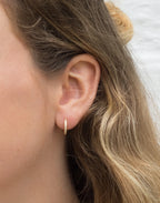 Vicky White Topaz Huggie Earrings