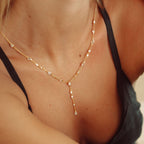 The Y Drop Necklace in Gold and Zirconia