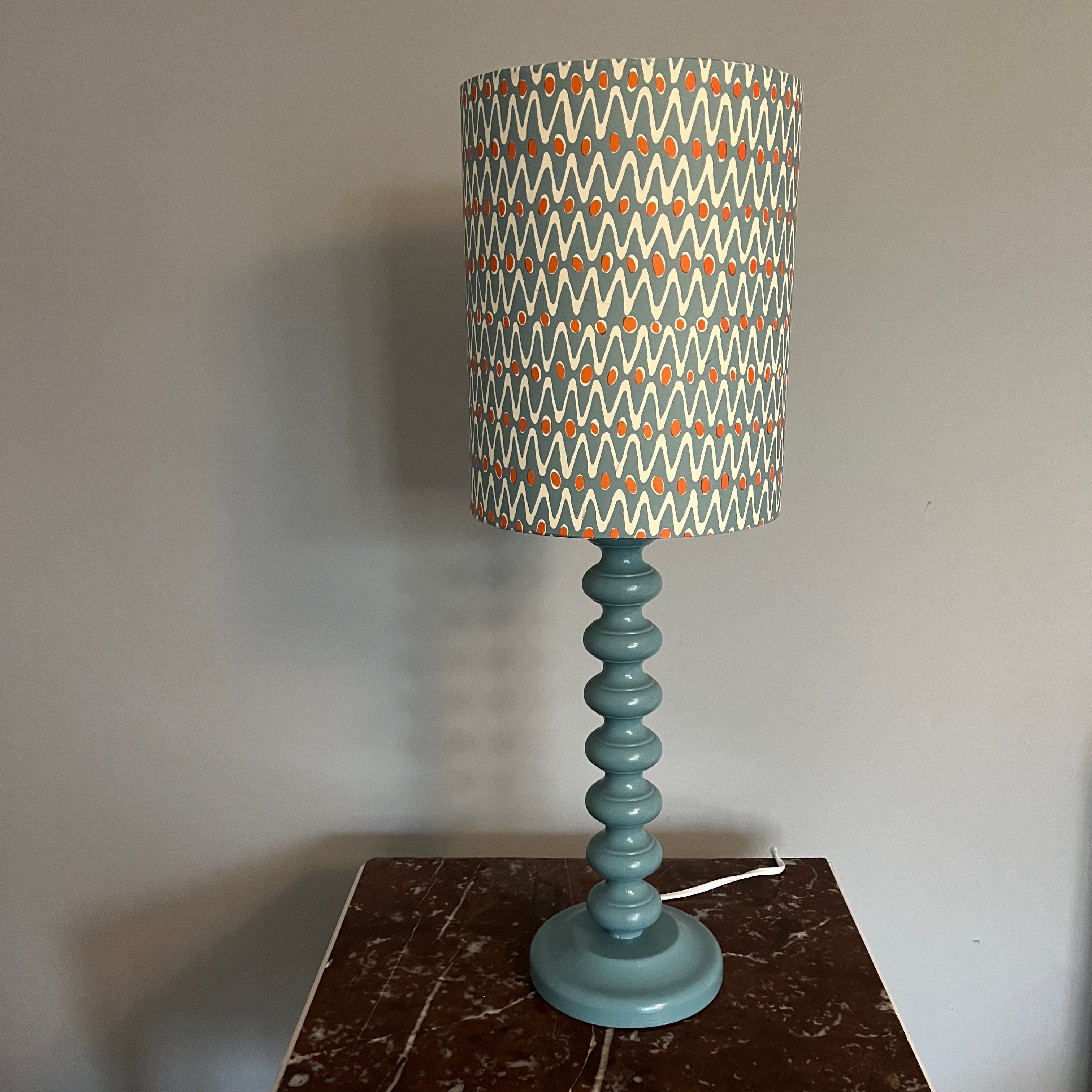 Contemporary handmade lampshade in blue and orange with a modern design