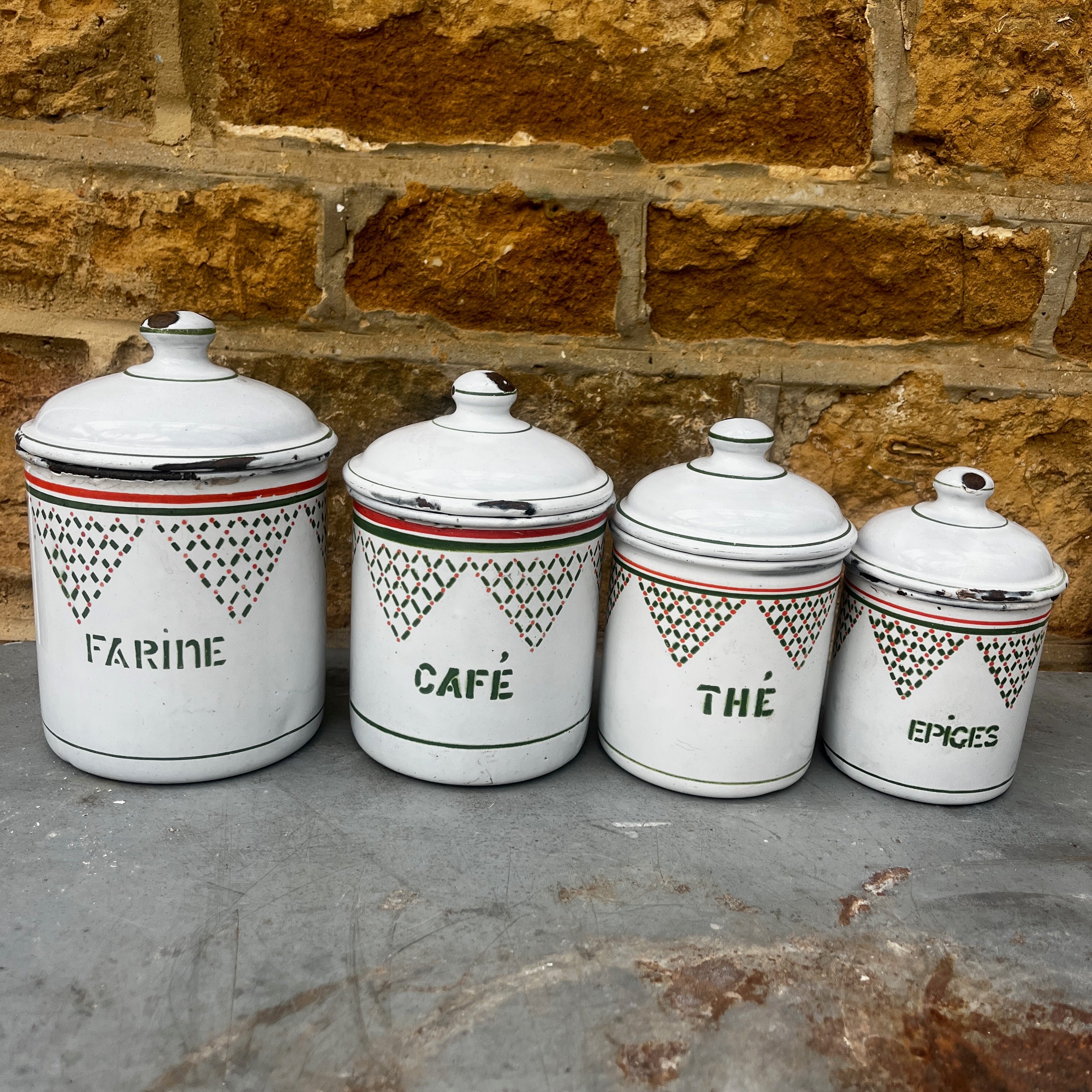 A Set of Four Vintage French Enamel Kitchen Storage Containers